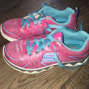Pink and blue Skechers sneakers
